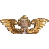 Italian carved,  painted and giltwood cherub