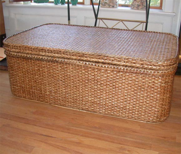 Large rattan trunk with large serving tray inside and storage below. Lid when closed functions as coffee table.