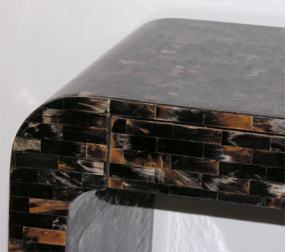 A Maitland Smith Tessellated Horn Waterfall Console. 2