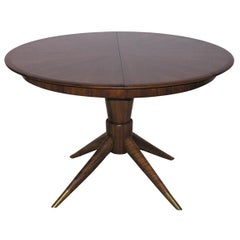 A Round Wood Dining Table in the manner of Gio Ponti.