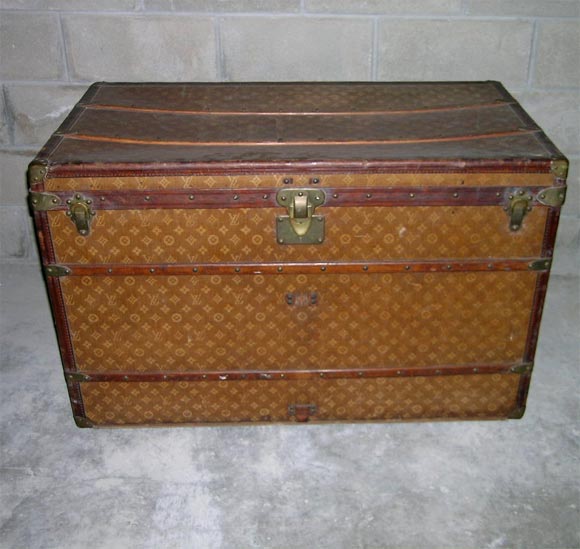 Louis Vuitton Large travel trunk c1893. This Louis Vuitton trunk is all original including the four graduated inserts. Three of the inserts measure 6 inches deep and on is four inches. There is also a fifth that is small and fits in the top insert.