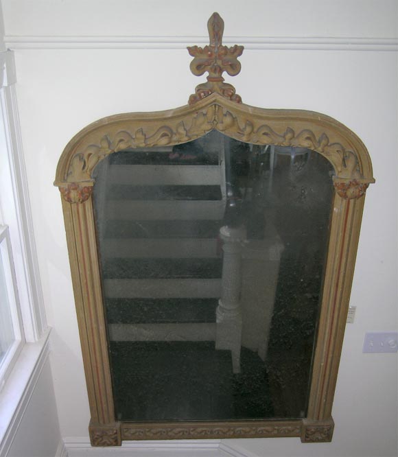 This large mirror is trimmed with gorgeous moldings and carved painted wood frame. Original distressed mirror - aged beautifully.
 