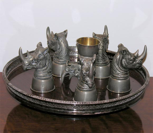 Rare silver leaf set of six drinking goblets in the form of rhinos by Gucci.Rotating tray sold separately.