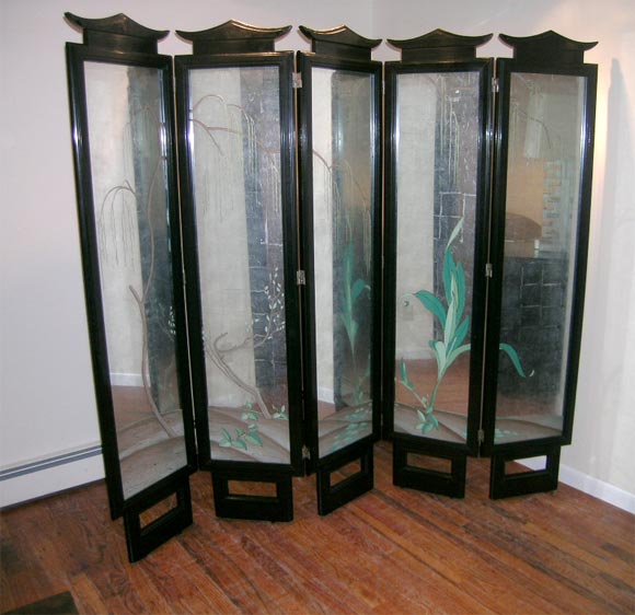 Spectacular folding screen with reverse painting on silver leafed glass panels encased in black lacquered wood frames with a pagoda top and burnt in JAMES MONT signature to the reverse side.