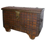 Wooden storage box on wheels.