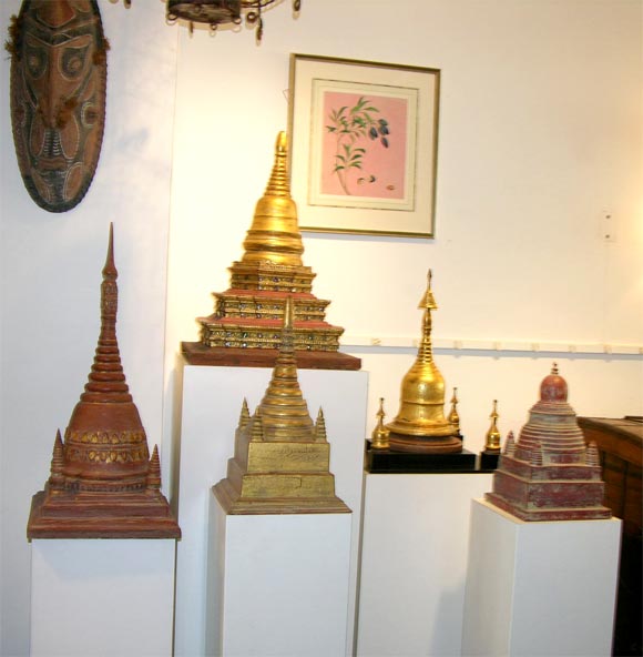 Thai wood stupas on custom white stands. Sold individually or as a collection.