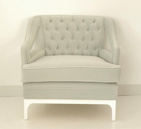 This chair, inspired from the original by Diskin Art, features a deep and comfy seat with a tufted back and loose cushion. The base is white gloss enamel. This chair is custom order and therefore the finish can be customized. The chair requires