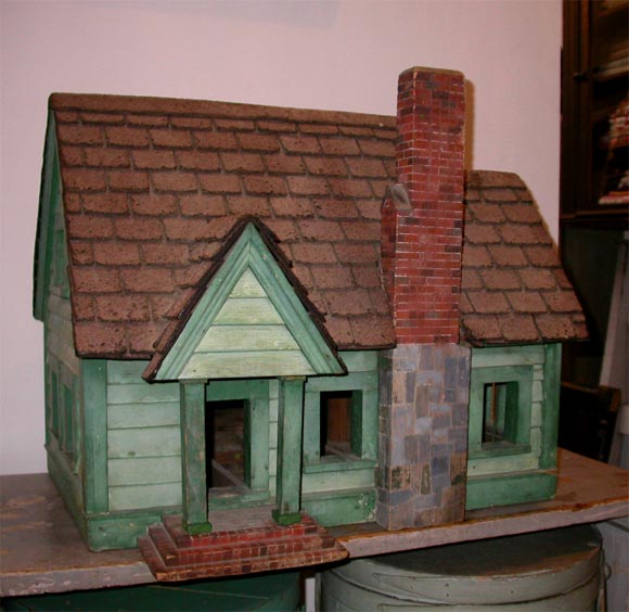 Late Victorian wooden green dollhouse. Lots of fine details and charm.