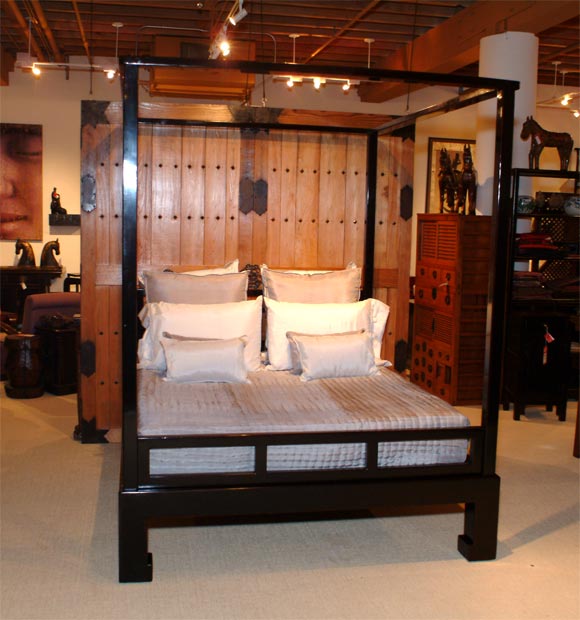 Queen-size black lacquer contemporary canopy bed. Removable posts for easy moving. Assembly required.