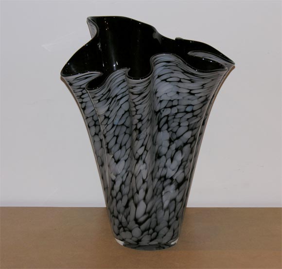 Generously oversize scarf vase by Alicja of Poland. The vessel's art-glass exterior is deepest ruby, nearly black with translucent white splotch patterning.