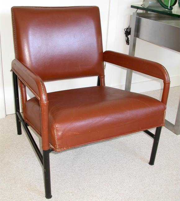 Lounge chair in brown stitched Hermes leather and iron designed by Jacques Adnet for the luxery liner SS France, France, 1950's.