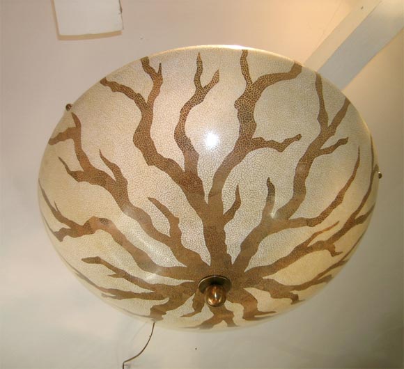 Tree branches gracefully caress this resin dome shaped ceiling fixture by Maitland Smith