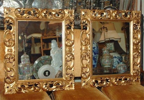 A pair of Rococo style carved wood and gilt wall mirrors. Carved with connecting C scrolls and acanthus leaves.
Italian, late 19th century.
 