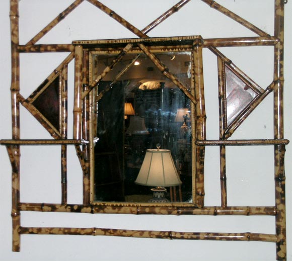 Victorian bamboo hanging mirror, decorative lacquer plaques, with shallow shelves on either side of the glass.