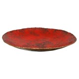 A red enameled copper bowl by Marcello Fantoni.
