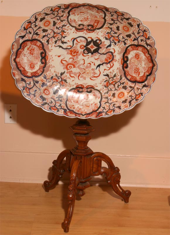 Very unusual tilt-top display table, featuring a large Imari charger firmly attached to a late Victorian walnut pedestal table.