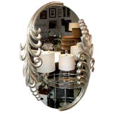 A Fanciful White Gold Framed Oval Mirror