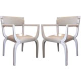 A Pair of Leather Upholstered Arm Chairs by Tommi Parzinger