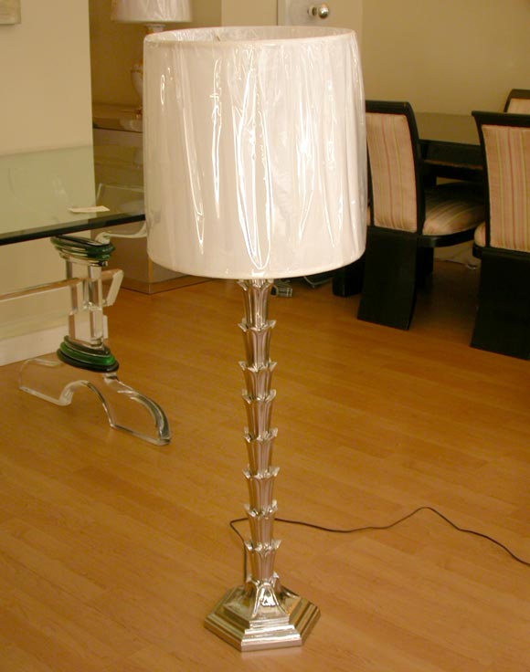 Nickel floor lamp w/ a palm motif.Sale price noted