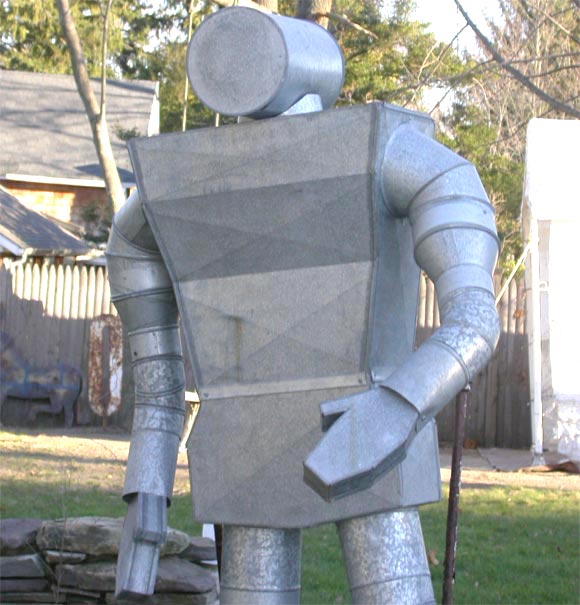Folk art sculpture of a man assembled from ac parts by a tinsmith in Ohio.  Similar pieces from the artist can be seen on diplay in the Smithsonian Museum.