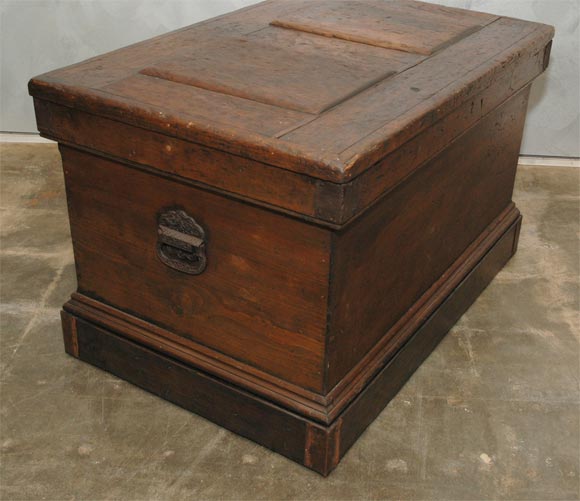 This Carpenters chest has 4 sliding trays, with brass knobs, and other compartments for the craftsman's saws and working tools. The panelled lid is hinged and there is an inset lock. The corners are strapped in metal for protection and there are