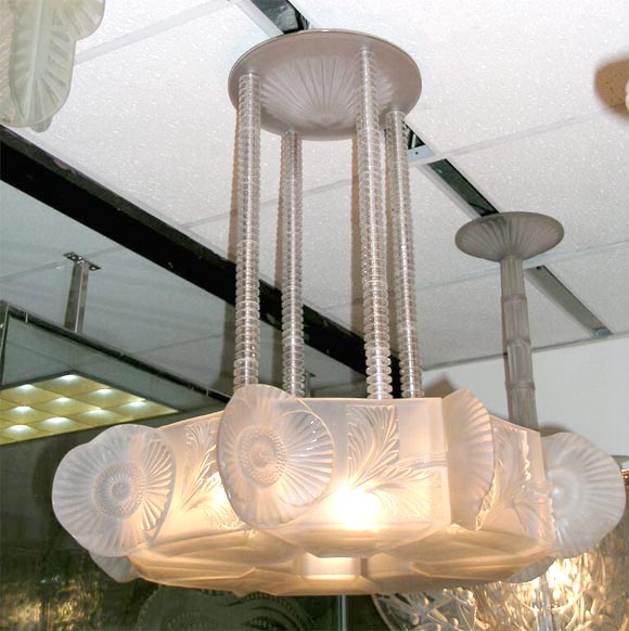 Highly important chandelier by Rene Lalique, a 1929 design “Coquelicots”.<br />
Clear and frosted molded glass, Diameter 31”, Drop31” (may be changed to your specs)<br />
Ref. Felix Marcilhac “Catalogue Raisonne de l’oeuvre de Verre” Fig. 2297 pg.