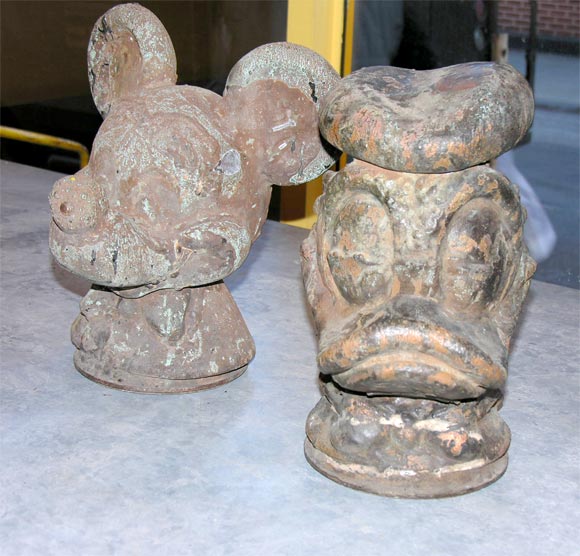 Mickey Mouse and Donald Duck metal molds used for making children's masks.  Masks were cast on the inside of these molds, they are hollow with a smooth finish on the inside.  Very rare disney character find.  Sold as a pair only.