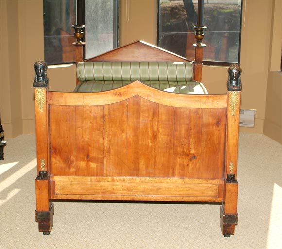 Rare 3/4 double Empire Daybed-<br />
gilt bronze parcel ebonized fruitwood<br />
triangular pediment headboard below ebonized urns<br />
curved pediment footboard below engaged caryatid with bronze mounts<br />
terminating to square feet on