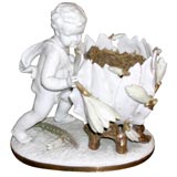 Porcelain angel with flowers jardiniere