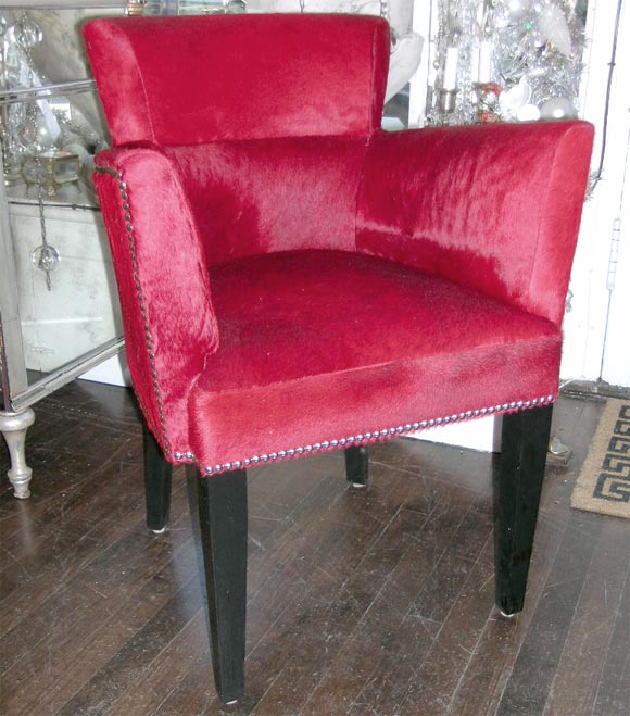 French Deco style armchair with nickel nailheads and black lacquered wooden legs. Upholstered in genuine red cowhide. Customization is available in different sizes, finishes and hides/fabrics.