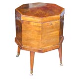 English mahogany octagonal cellarette with a fitted interior.