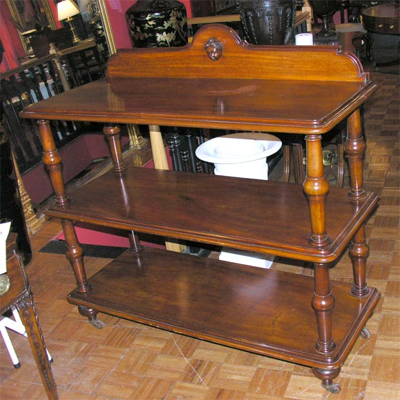 19th Century Mahogany Three Tier Etagère On Castors.