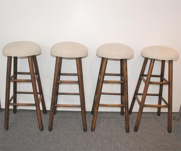 SET OF FOUR MATCHING 1930'S BAR STOOLS WITH LINEN SEATS