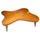 Free form bleached mahogany table.