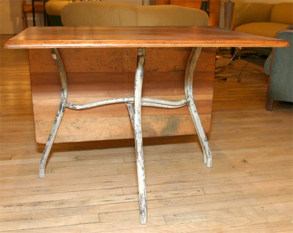 unique folding table with tubular iron base.