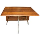 unique folding table with tubular iron base.