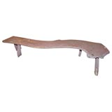 salmon colored free form coffe table or bench