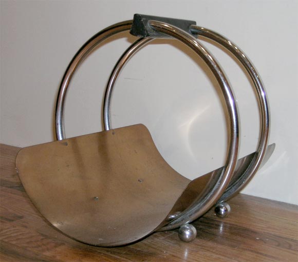 Log holder of circular form manufactured by Revere, c. 1935.
