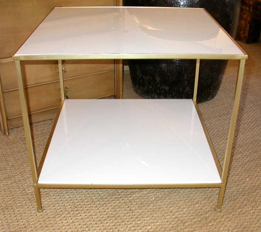 Pair of white milk glass and brass side tables