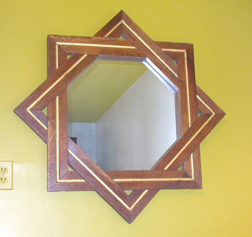 Pair  of Oak Interlocking Star Mirrors.