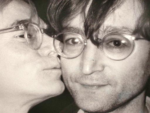 Photograph of Andy Warhol kissing John Lennon.  Photo taken by Christopher Makos and signed by photographer 1978.  Black and white photograph, beautiful resolution. One-of-a-kind shot.