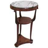 A Biedermeier Parcel Ebonized Walnut Gueridon