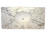 Vintage oval sink with marble countertop