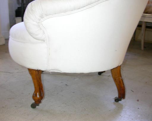 Tufted slipper chair with turned mahgany legs
