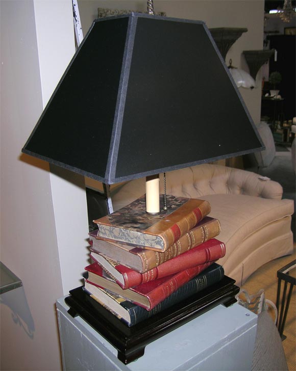 Pair of book lamps fabricated from old Scandanavian books, mounted on wood bases, with new wiring and new shades.