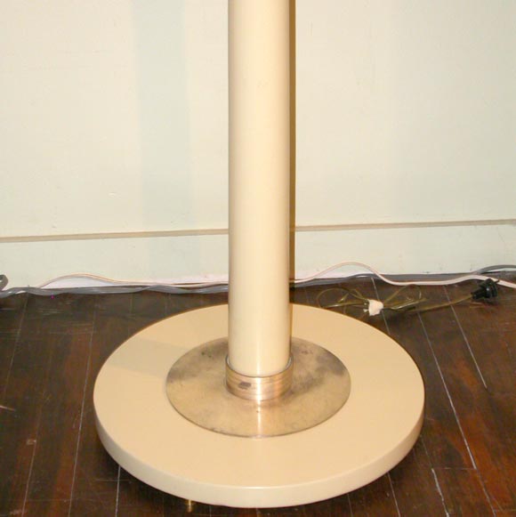 Elegant torchiere-style floor lamp. Bold scale and wired for American electrical. Silvered metal and off-white lacquered wood, with great detailing.