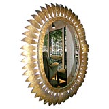 Oval gilt metal mirror Oval gilt metal mirror