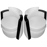 Pair of leather club chairs by Delaporte