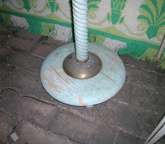 Green painted wood base with bronze collar. The shaft begins with carved wood then a cluster of glass rods and ends in a bronze collar. A painted wood globe sits upon the shaft. Six arms with lights extend from the globe.