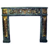 Antique Italian 19th century carved and gilt faux-marble mantel.